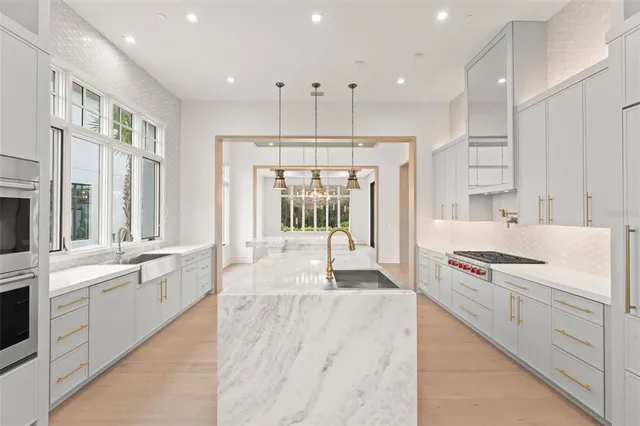 a bathroom with a shower and a glass door