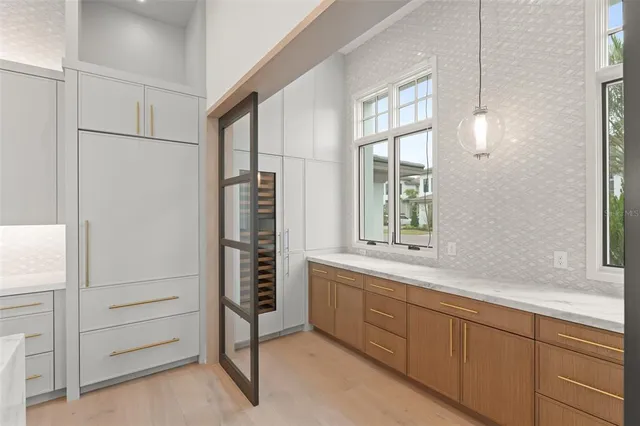 a bathroom with a shower and a window