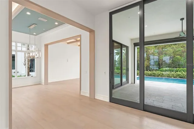 a view of a room with windows and chandelier