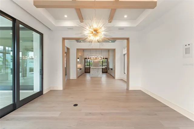a kitchen with stainless steel appliances kitchen island granite countertop a sink stove and refrigerator