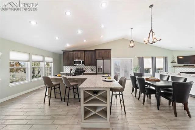 a view of a dining room with furniture window and outside view