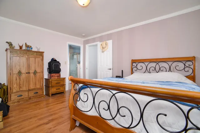 a front view of a house with entryway and wooden floor