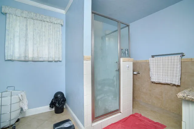 a room with a couch and a dresser