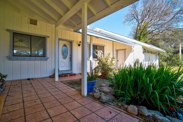 a backyard of a house with seating space