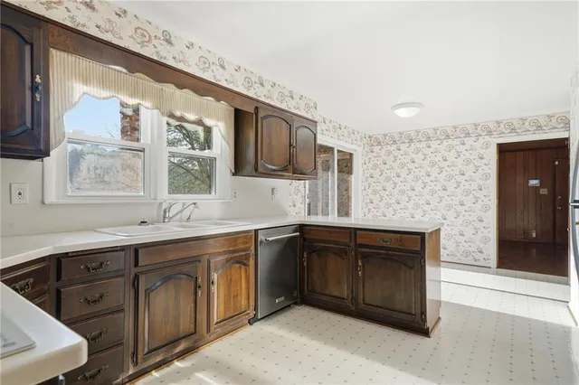 a spacious bathroom with a granite countertop sink mirror and