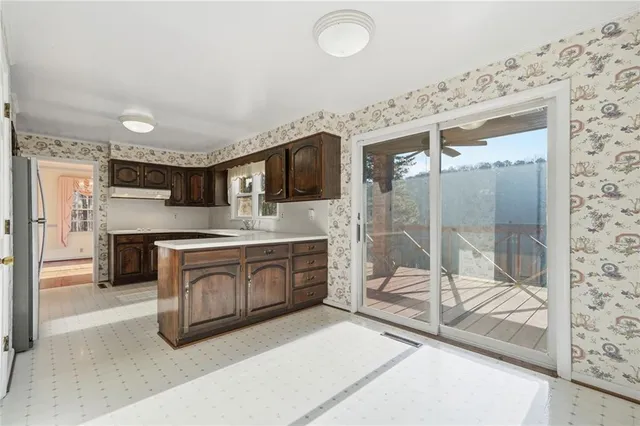a spacious bathroom with a shower sink and mirror