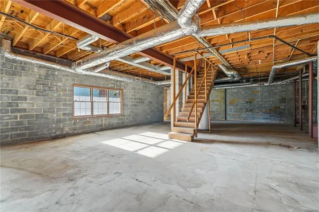 a view of an empty room with a fireplace