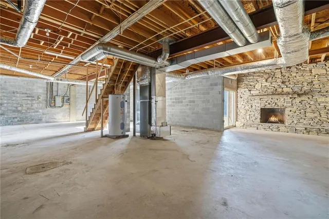 a view of an empty room with a fireplace