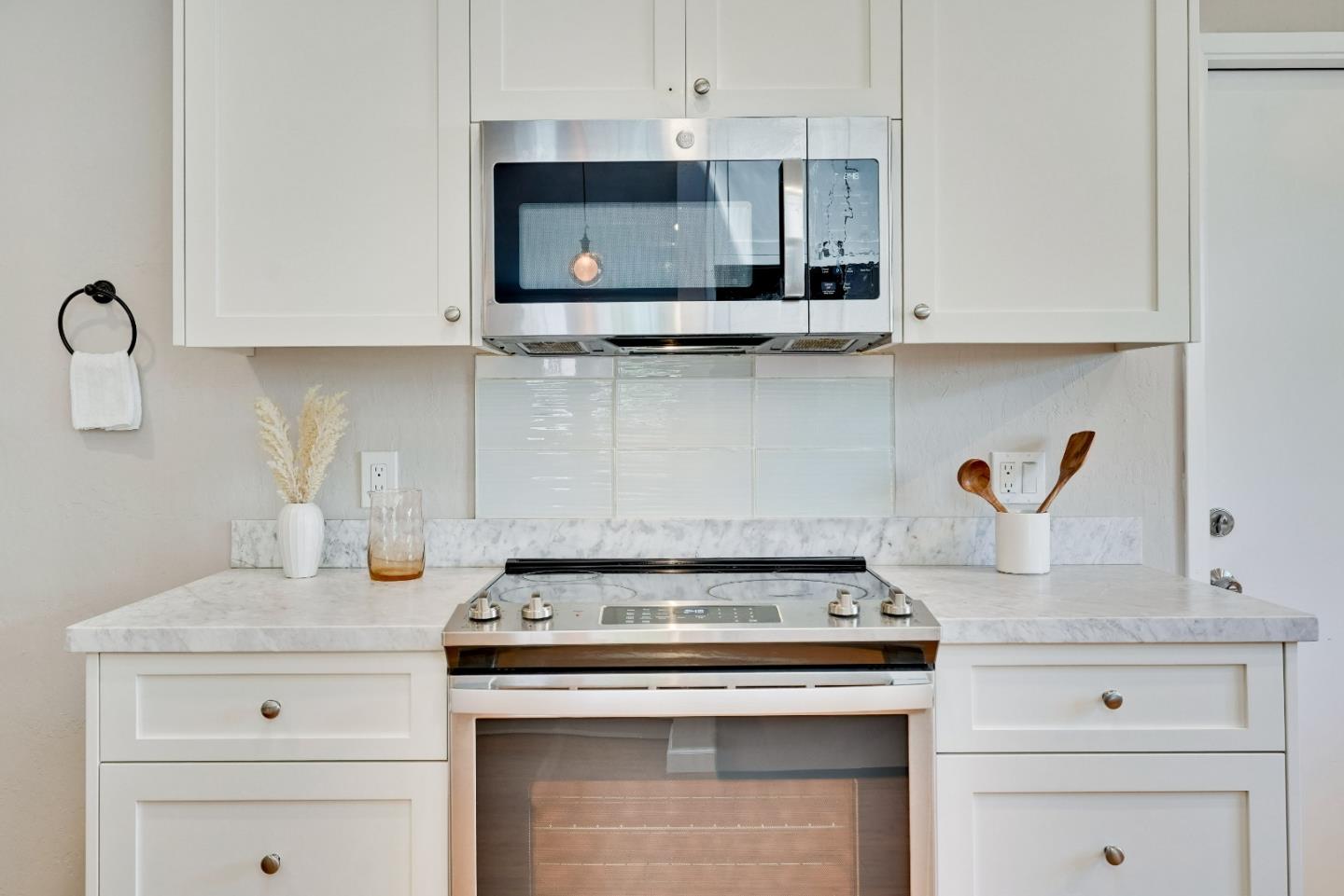 1755 Ravizza Avenue Santa Clara, CA 95051 - Photo 18 of 36 a stove top oven sitting inside of a kitchen