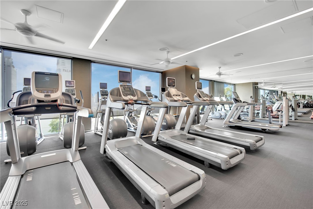 4381 West Flamingo Road, Unit 1901 Las Vegas, NV 89103 - Photo 12 of 18 Gym featuring ceiling fan and floor to ceiling win