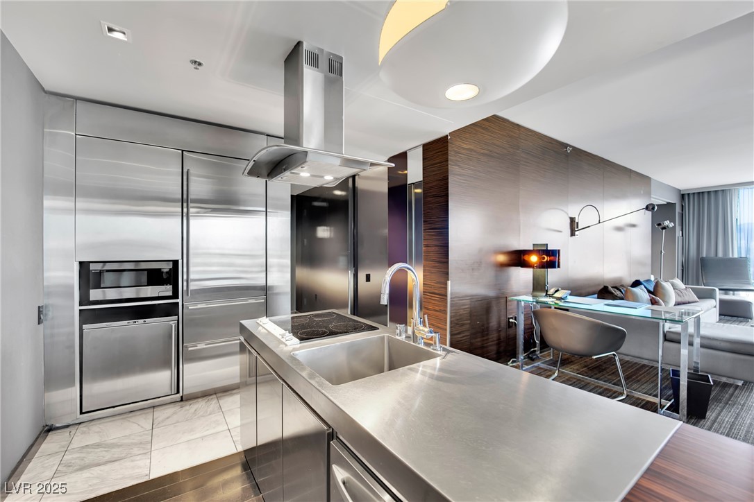 4381 West Flamingo Road, Unit 1901 Las Vegas, NV 89103 - Photo 4 of 18 Kitchen featuring island exhaust hood, stainless s