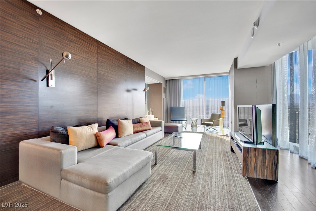 4381 West Flamingo Road, Unit 1901 Las Vegas, NV 89103 - Photo 5 of 18 Living room with wood finished floors and floor to