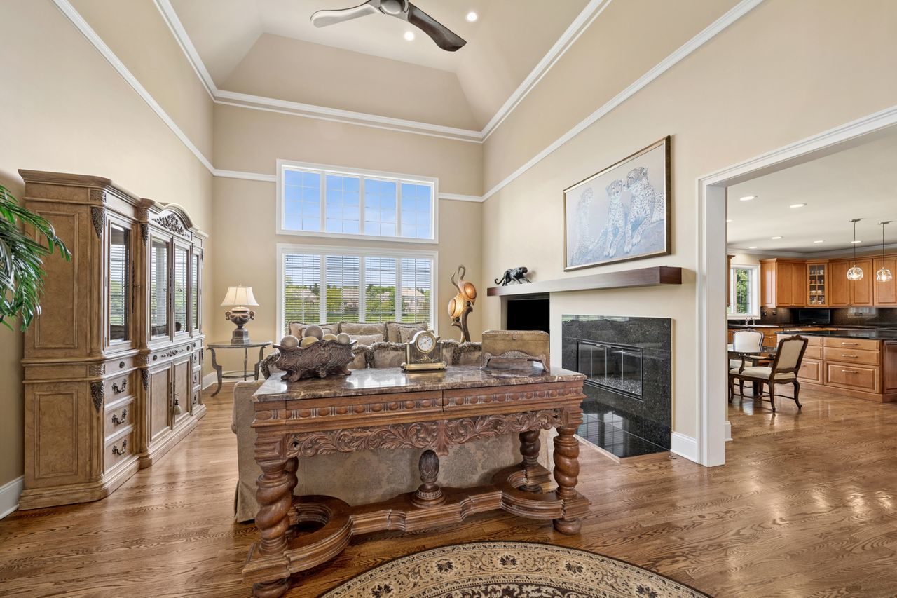 1029 Ridgeview Drive Inverness, IL 60010 - Photo 23 of 58 a dining room with furniture a fireplace and wooden floor