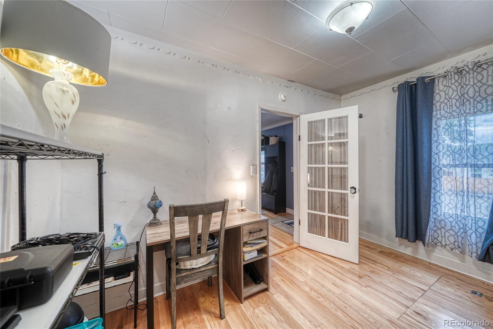 306 Elm Street Leadville, CO 80461 - Photo 13 of 42 a view of a dining room with furniture and wooden floor