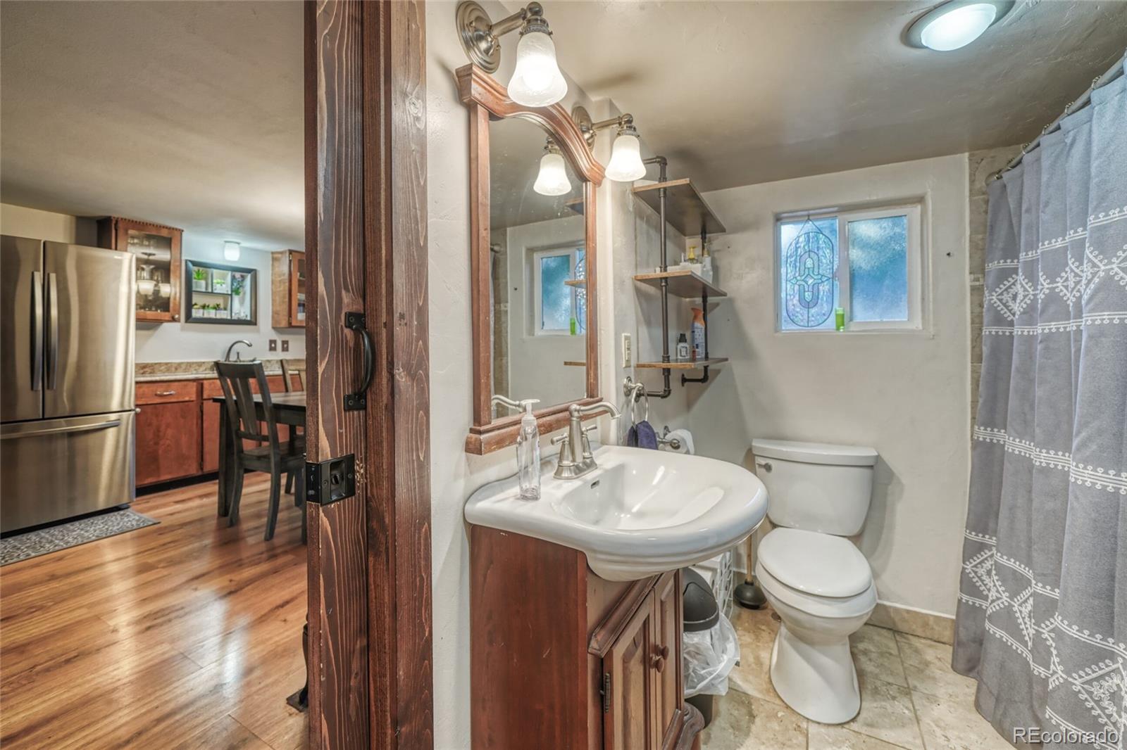 306 Elm Street Leadville, CO 80461 - Photo 16 of 42 a bathroom with a toilet sink and mirror