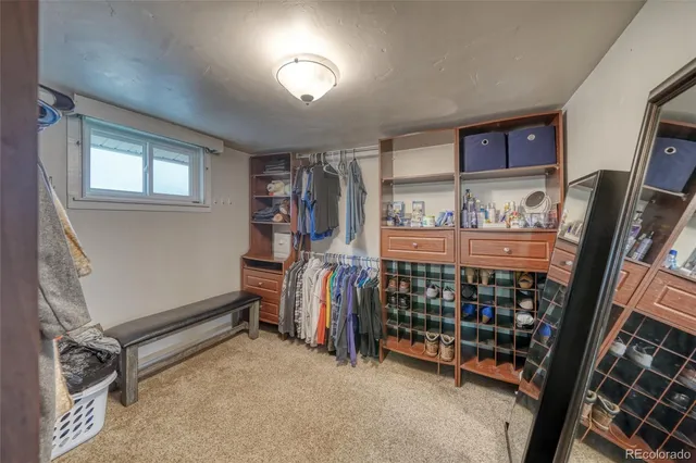 a room with lots of furniture and a window