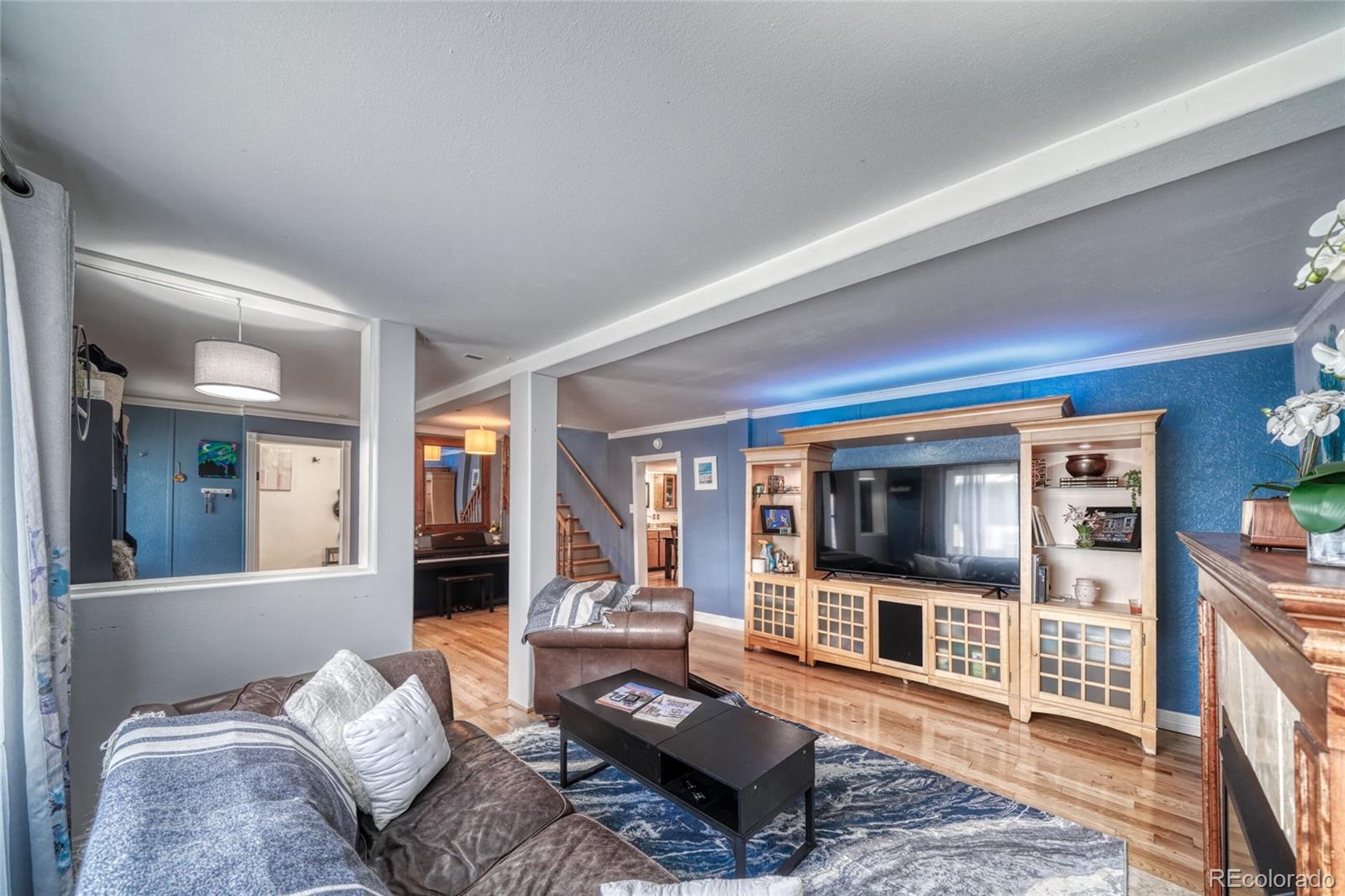 306 Elm Street Leadville, CO 80461 - Photo 9 of 42 a living room with furniture and a flat screen tv