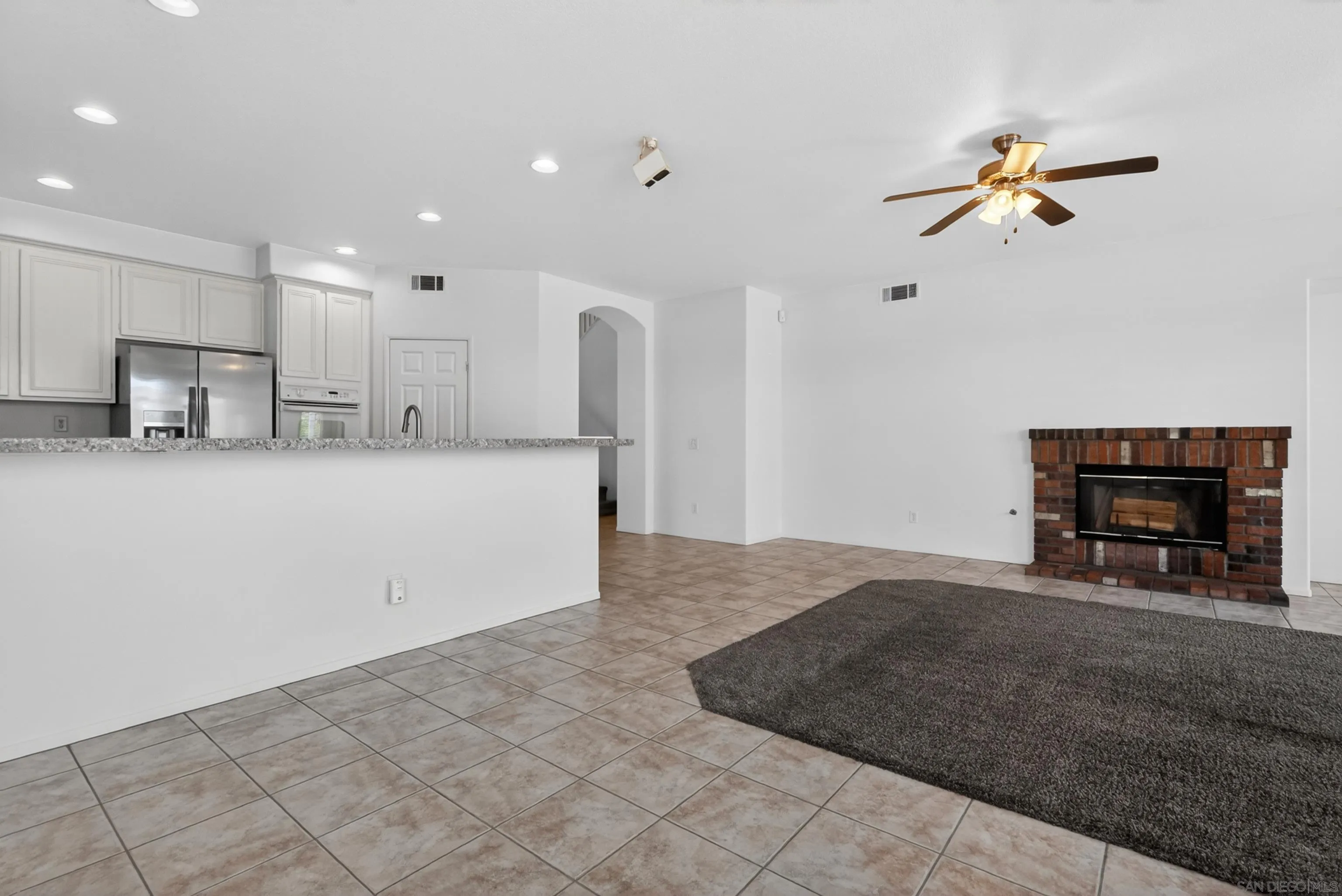 1432 Belmont Park Road Oceanside, CA 92057 - Photo 27 of 54 a view of a kitchen with a sink and a refrigerator