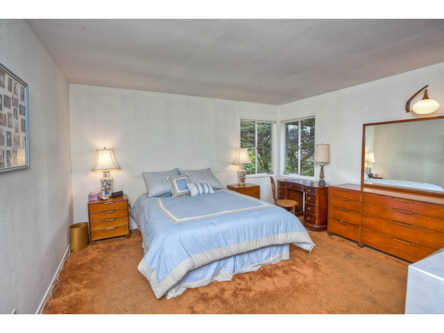 1859 Randall Road San Mateo, CA 94402 - Photo 12 of 22 a bedroom with a bed and wooden floor