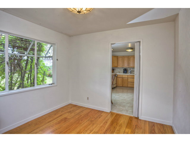 1859 Randall Road San Mateo, CA 94402 - Photo 5 of 22 a view of empty room with wooden floor and fan