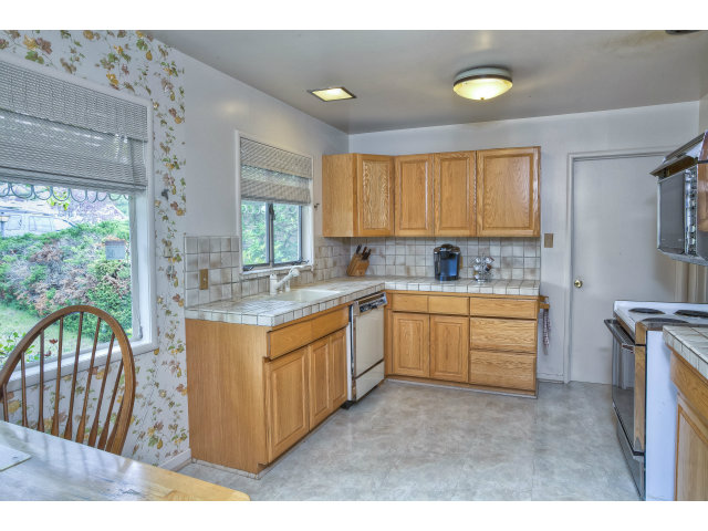 1859 Randall Road San Mateo, CA 94402 - Photo 6 of 22 a kitchen with a sink stove and cabinets