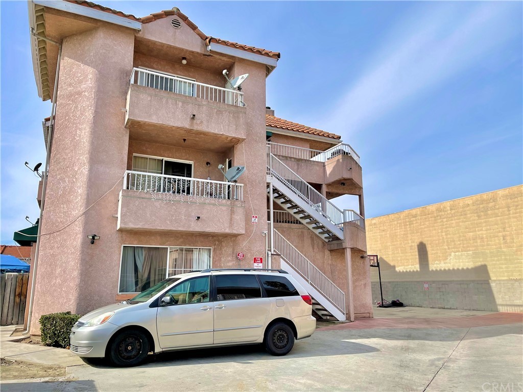14033 Paramount Boulevard Paramount, CA 90723 - Photo 1 of 1 a view of a car parked in front of a building