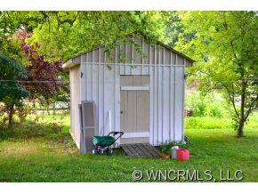 4267 Old Clyde Road Clyde, NC 28721 - Photo 5 of 11 a view of a house with backyard and garden