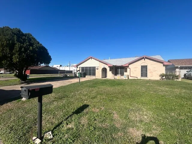 a house view with a garden space