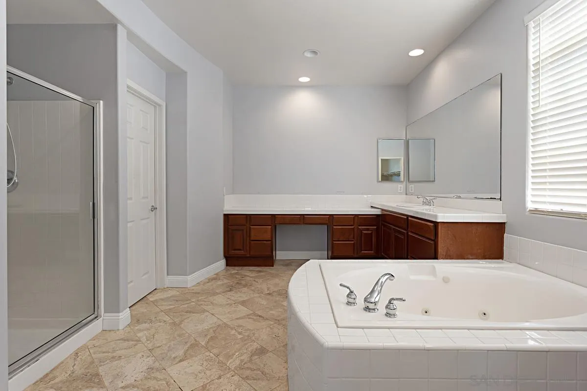 536 Echo Lane San Marcos, CA 92078 - Photo 17 of 24 a bathroom with a bathtub and a sink