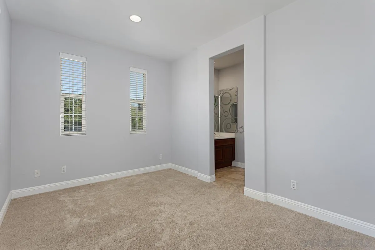 536 Echo Lane San Marcos, CA 92078 - Photo 19 of 24 an empty room with windows and closet