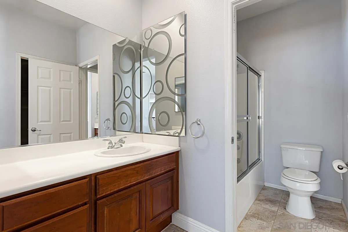 536 Echo Lane San Marcos, CA 92078 - Photo 20 of 24 a bathroom with a toilet sink and shower