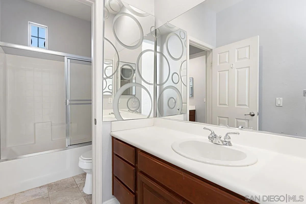 536 Echo Lane San Marcos, CA 92078 - Photo 22 of 24 a bathroom with a sink a toilet and shower