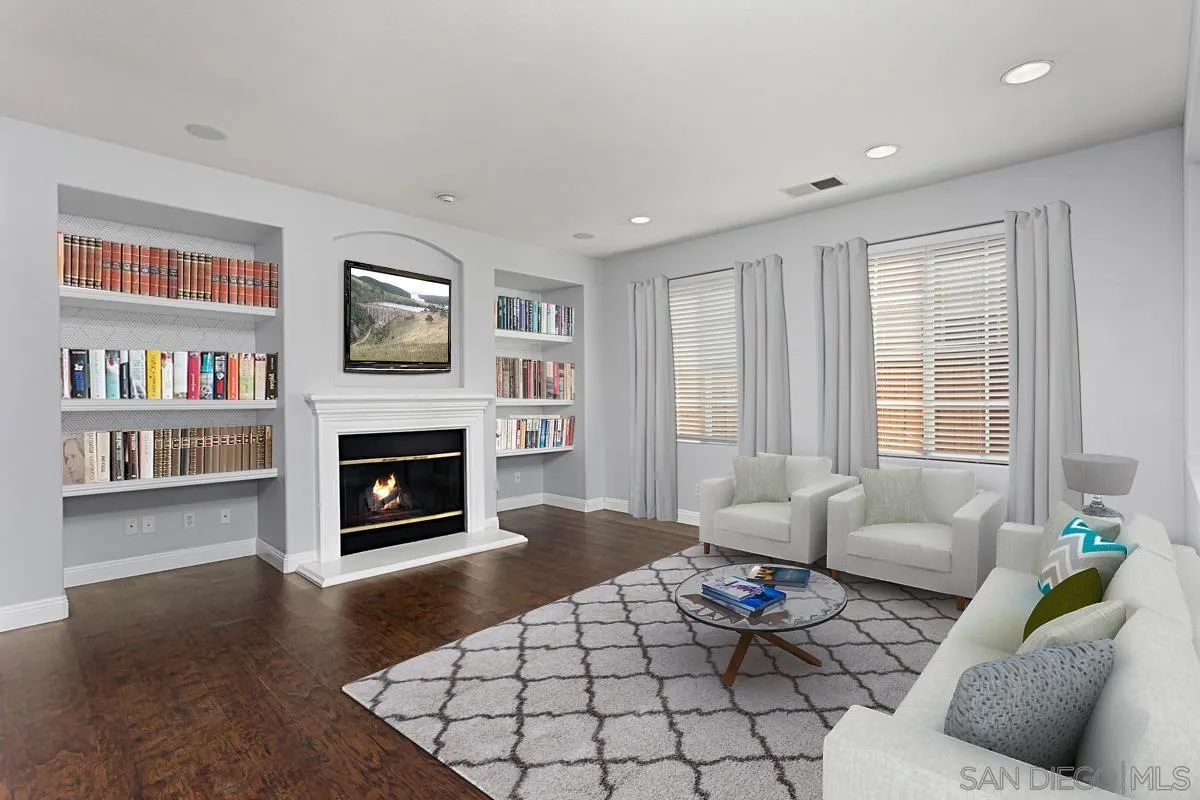 536 Echo Lane San Marcos, CA 92078 - Photo 5 of 24 a living room with furniture a rug and a fireplace