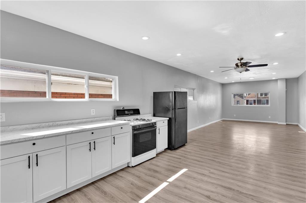 1406 Broadway Avenue McKees Rocks, PA 15136 - Photo 12 of 28 a view of a kitchen with a sink a refrigerator and window