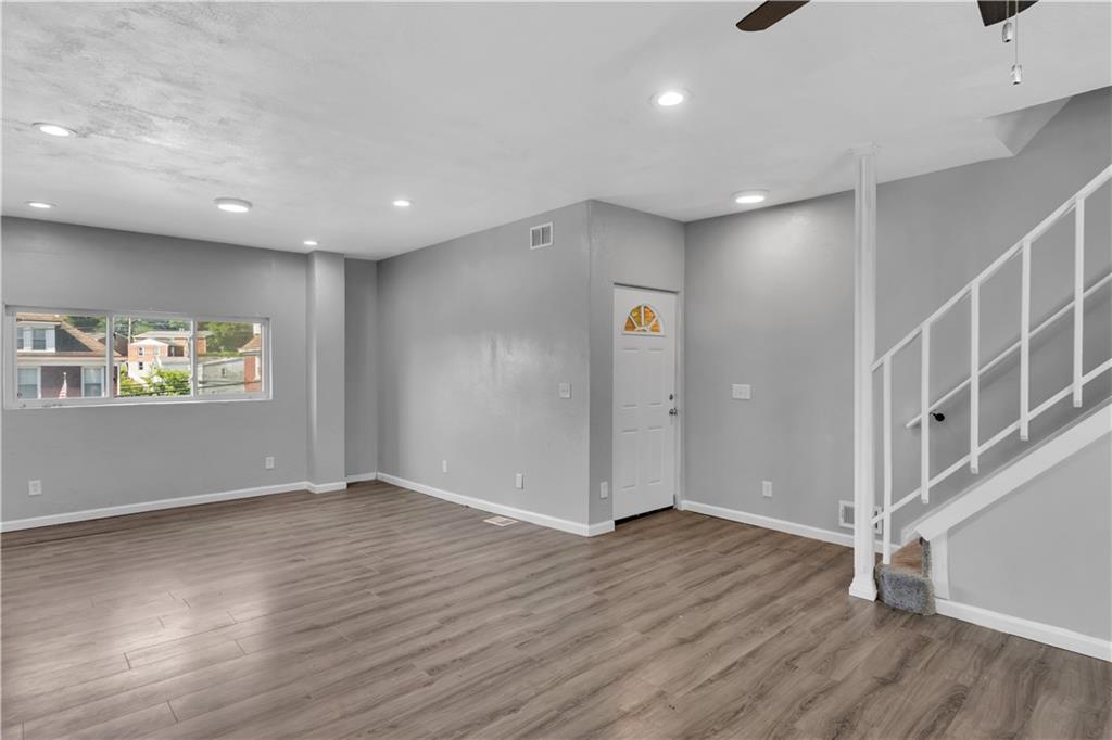 1406 Broadway Avenue McKees Rocks, PA 15136 - Photo 13 of 28 a view of an empty room with wooden floor