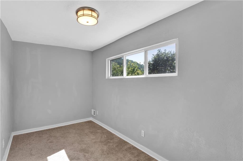 1406 Broadway Avenue McKees Rocks, PA 15136 - Photo 15 of 28 an empty room with windows