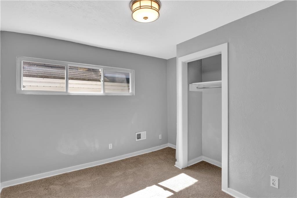 1406 Broadway Avenue McKees Rocks, PA 15136 - Photo 18 of 28 a view of an empty room with window and closet area