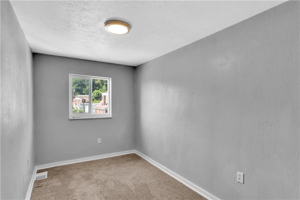 1406 Broadway Avenue McKees Rocks, PA 15136 - Photo 19 of 28 an empty room with windows