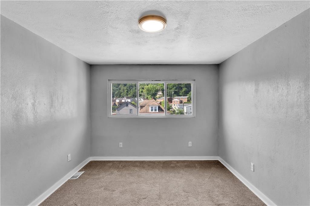 1406 Broadway Avenue McKees Rocks, PA 15136 - Photo 20 of 28 an empty room with windows