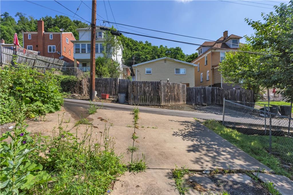 1406 Broadway Avenue McKees Rocks, PA 15136 - Photo 28 of 28 a view of a house with a yard