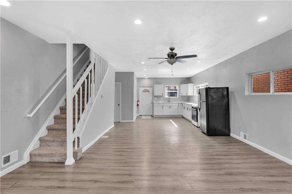1406 Broadway Avenue McKees Rocks, PA 15136 - Photo 8 of 28 a view of a room with wooden floor and staircase