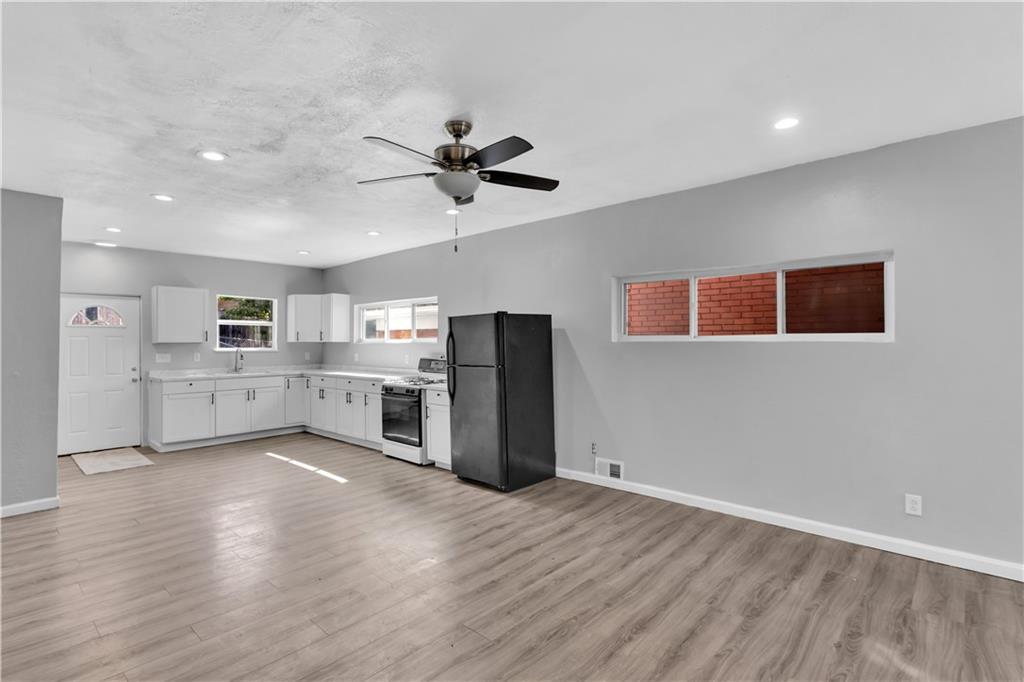 1406 Broadway Avenue McKees Rocks, PA 15136 - Photo 9 of 28 a view of a kitchen with a dishwasher and a refrigerator