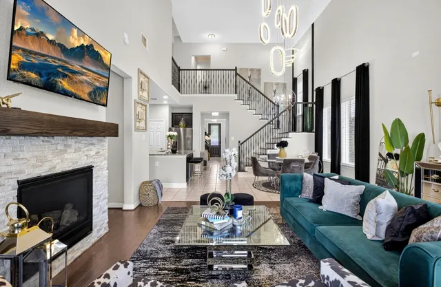 a living room with furniture fireplace and flat screen tv
