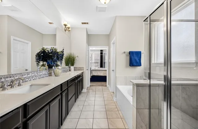 a kitchen with a sink and refrigerator