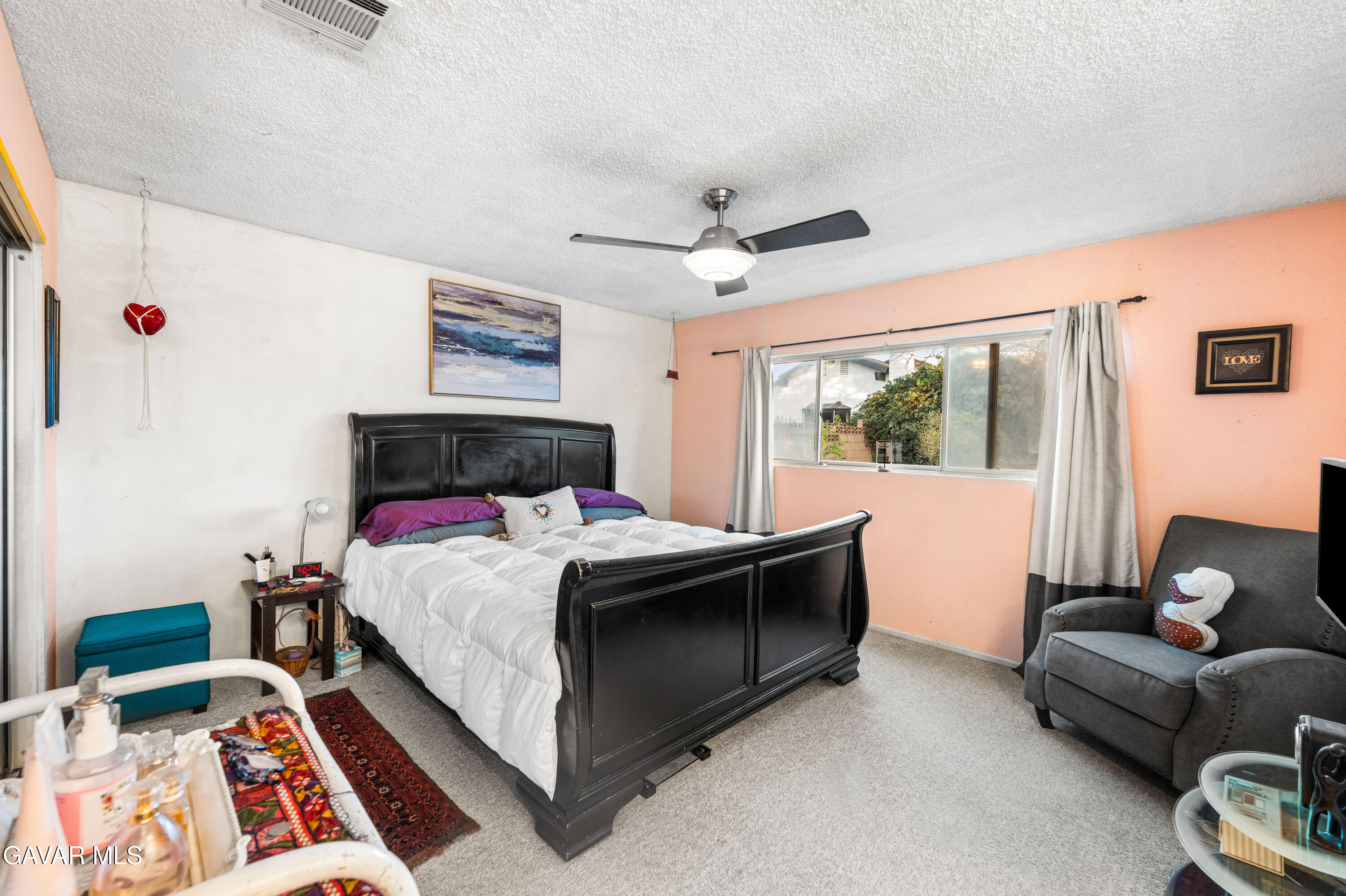 42902 Sachs Drive Lancaster, CA 93536 - Photo 12 of 55 a bed room with a bed and a couch