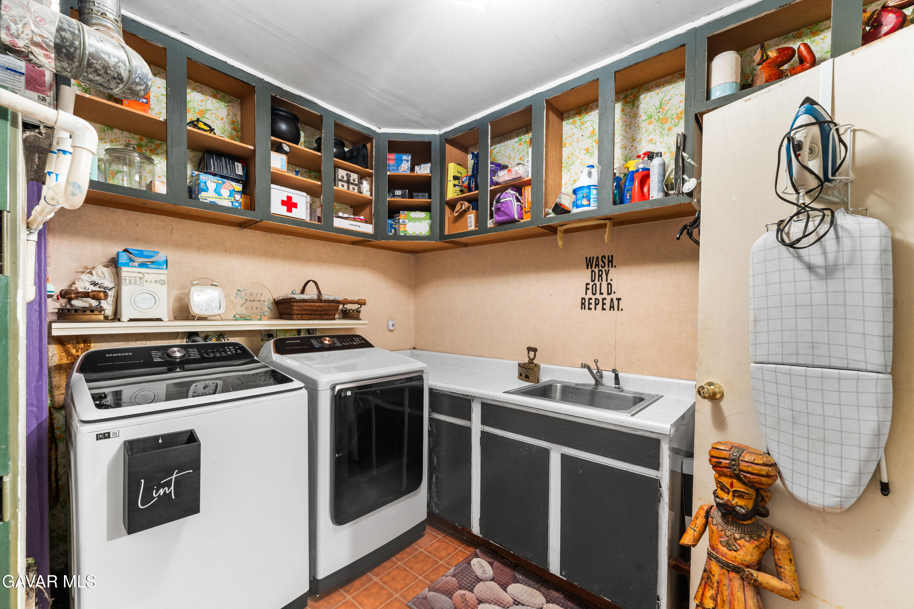 42902 Sachs Drive Lancaster, CA 93536 - Photo 23 of 55 a kitchen with stainless steel appliances granite countertop a stove and a sink