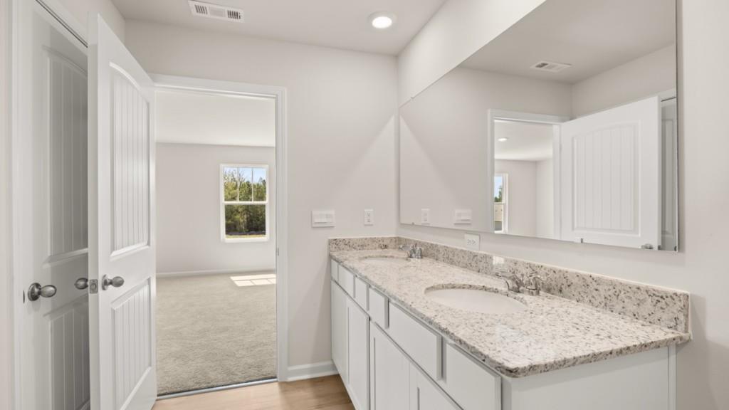 91 Babcock Drive Northeast Rome, GA 30165 - Photo 17 of 33 a bathroom with a granite countertop sink and a mirror