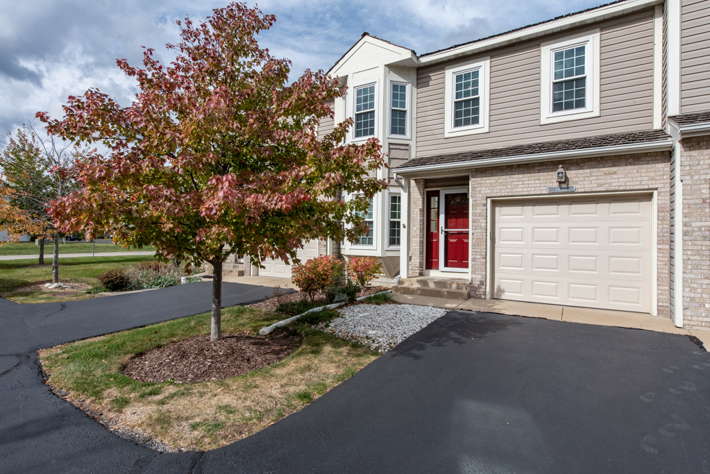 34321 Homestead Road Gurnee, IL 60031 - Photo 1 of 30 a front view of a house with a yard and garage