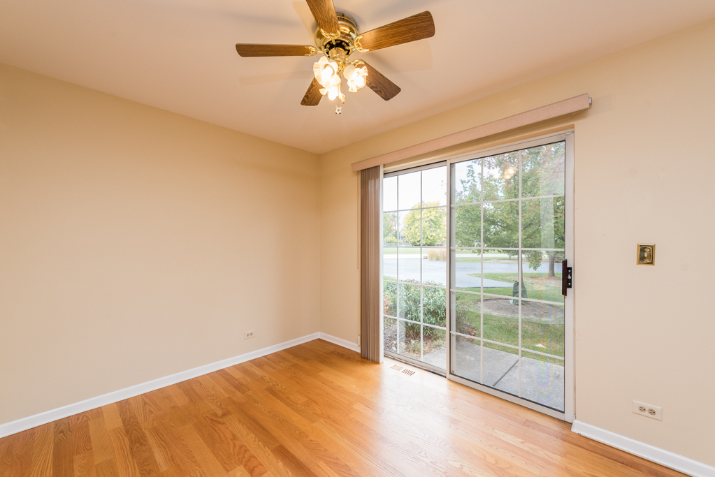 34321 Homestead Road Gurnee, IL 60031 - Photo 13 of 30 an empty room with wooden floor and windows