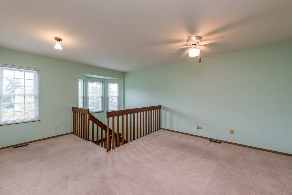 34321 Homestead Road Gurnee, IL 60031 - Photo 20 of 30 an empty room with fan and windows